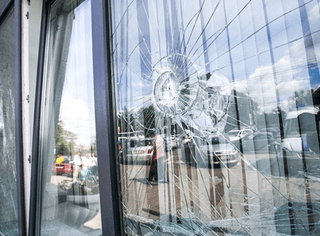 Emergency boarding-up and temporary securing of broken shopfront glass to protect property, reduce risk, and keep business operating across UAE