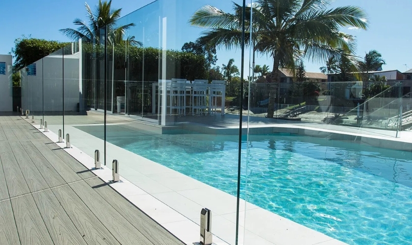 Premium frameless glass pool fencing in Dubai villa with self-closing gate, child-safe latch, and uninterrupted safety visibility